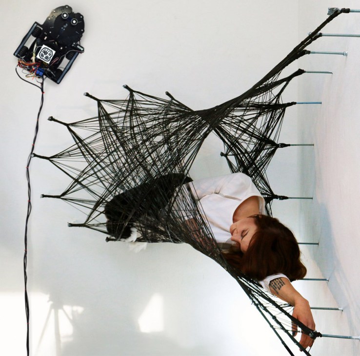 Watch wall-walking spiderbots weave ‘impossible’ structures with carbon fiber