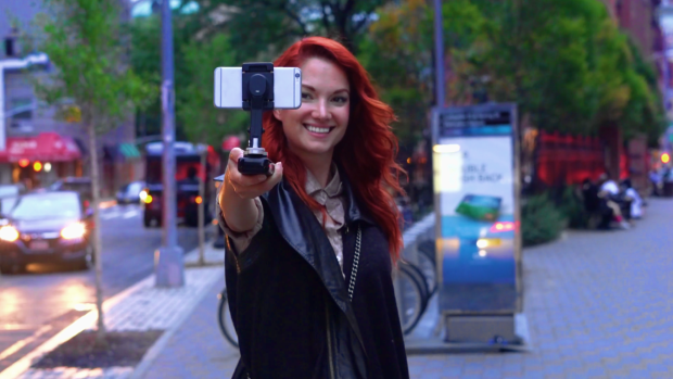 The SMOVE stabilizes and charges your phone for steady video shoots